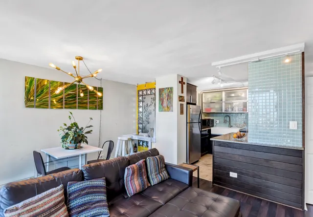a living room with furniture and a window