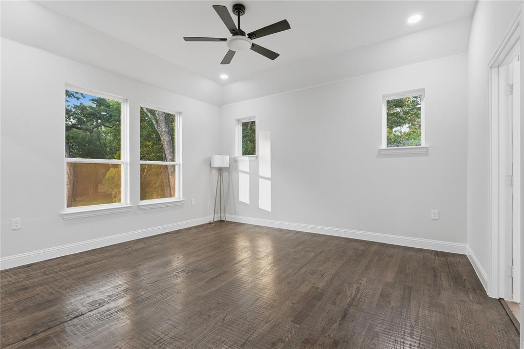 2150 Lakeview Mabank, TX 75156 - Photo 19 of 36 a view of an empty room with a window and wooden floor