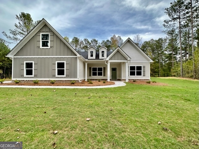 785 Polk Road Moreland, GA 30259 - Photo 1 of 1 a front view of a house with a garden