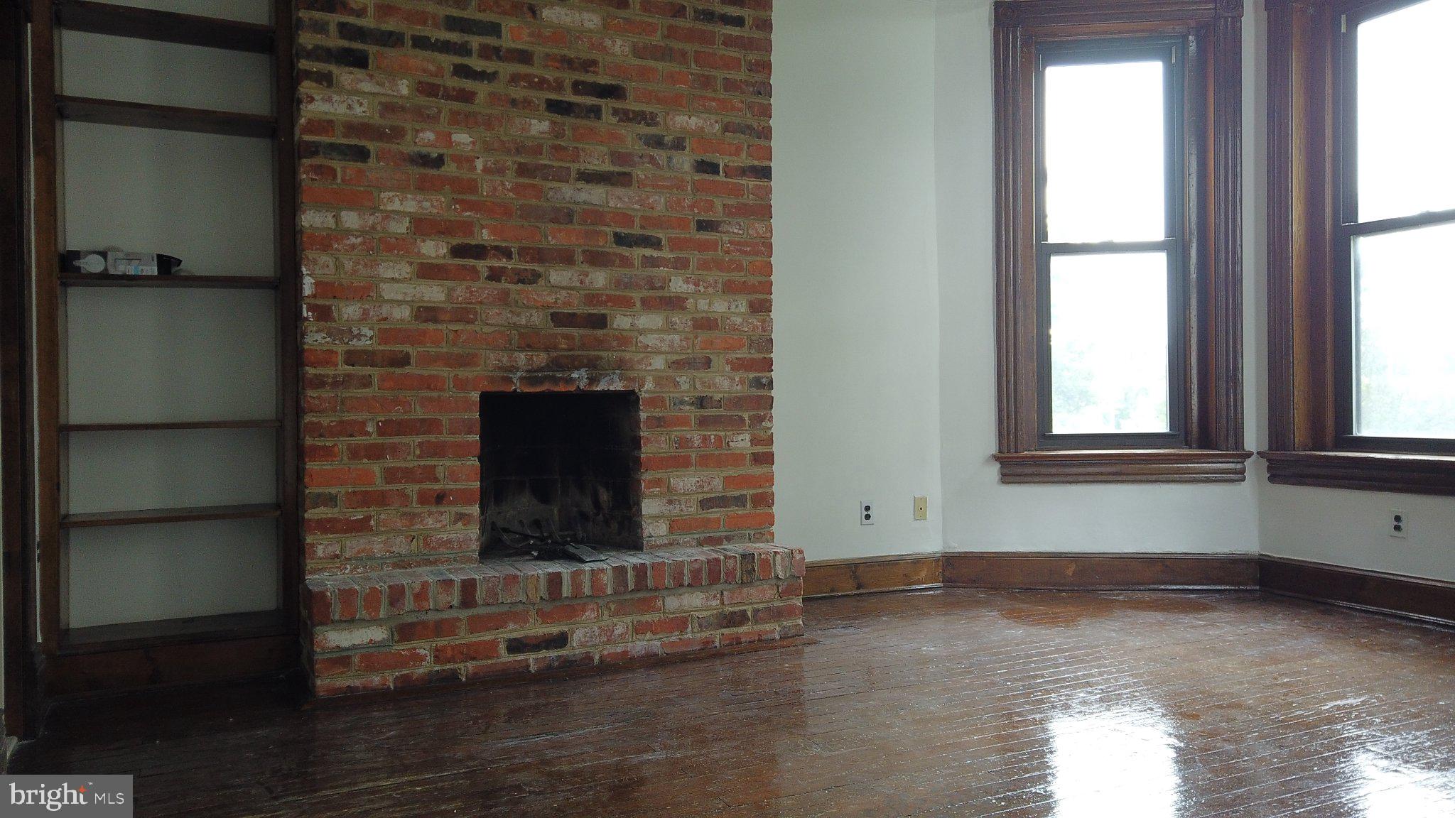 604 9th Street Northeast Washington, DC 20002 - Photo 19 of 28 Charming space with rustic fireplace.