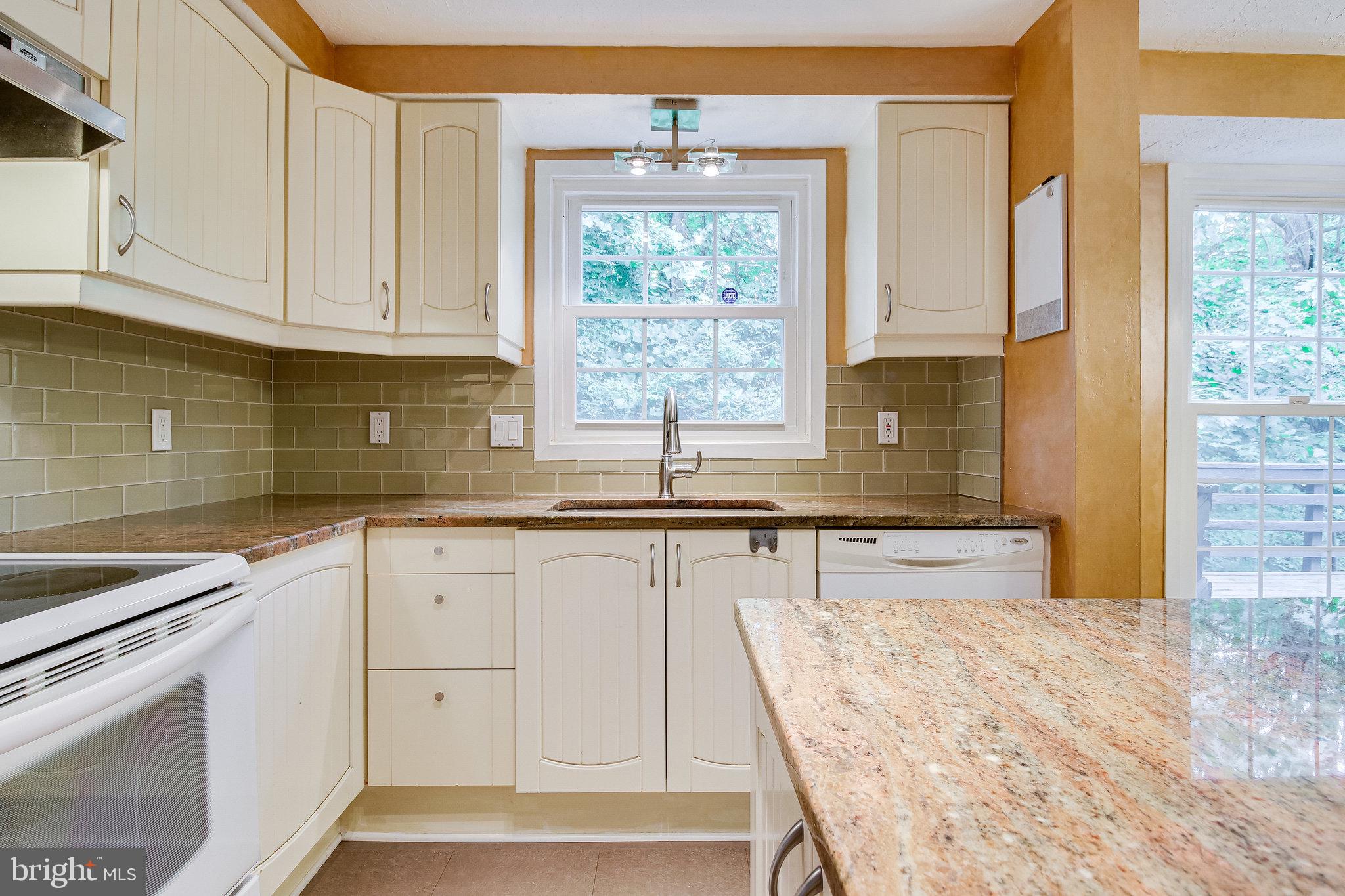 8301 Old Tree Court Springfield, VA 22153 - Photo 11 of 30 Tile backsplash and granite countertops