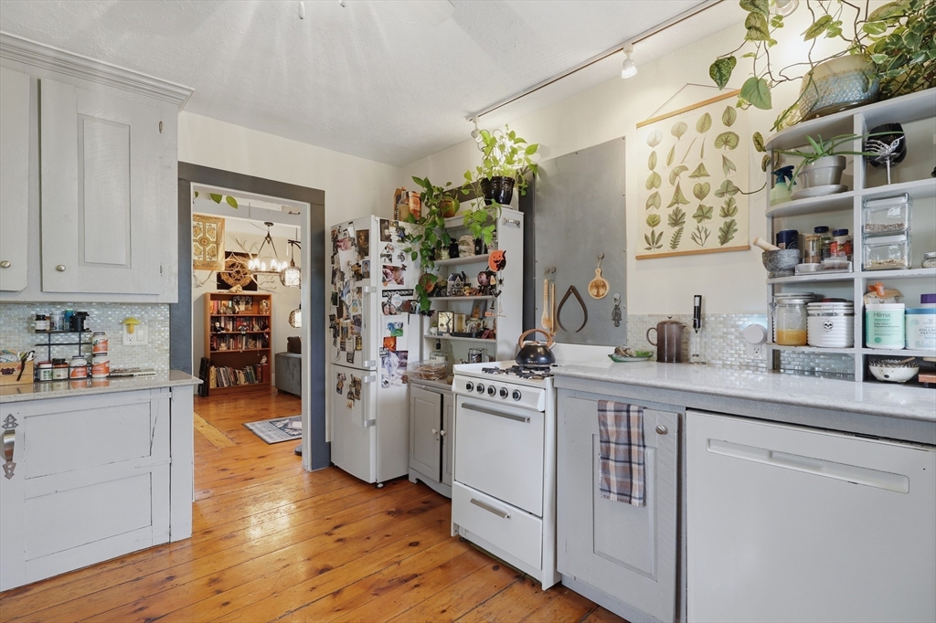 16 Evans Road, Unit 2 Marblehead, MA 01945 - Photo 4 of 24 a kitchen with a refrigerator and cabinets
