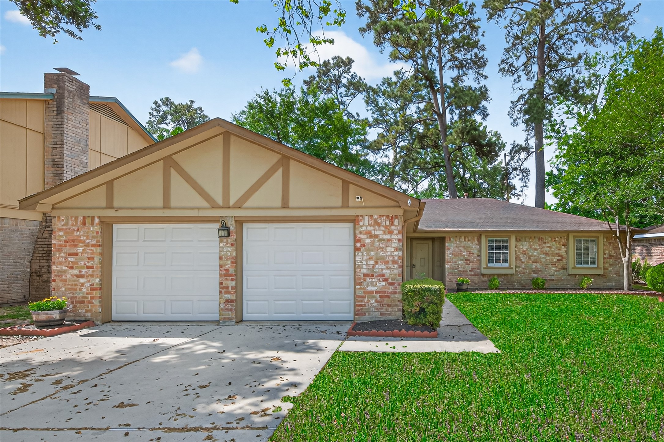 23919 Farm Hill Drive Spring, TX 77373 - Photo 1 of 41 a view of a white house next to a yard and large tree