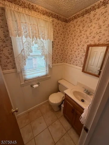 a bathroom with a toilet sink and tub