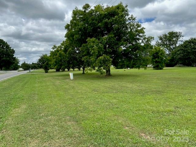 3738 Champion Road Rock Hill, SC 29730 - Photo 8 of 8 a grassy field with trees in the background
