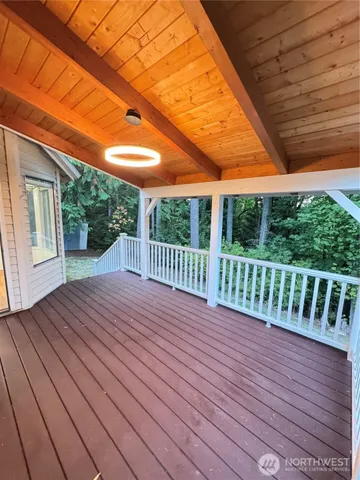 a balcony with wooden floor