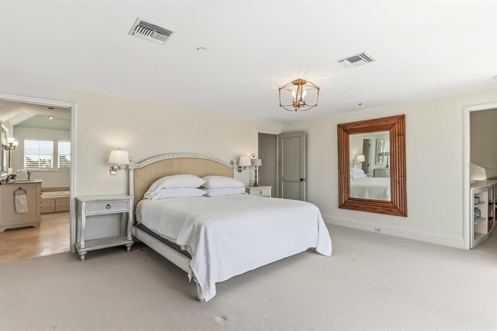 312 Baily Street Boca Grande, FL 33921 - Photo 20 of 41 a bed sitting in a bedroom next to a window