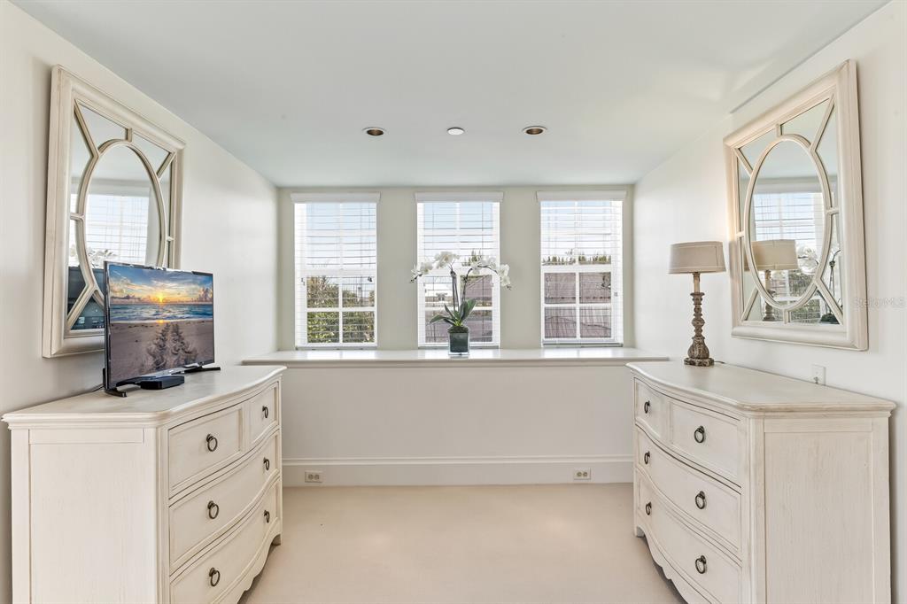 312 Baily Street Boca Grande, FL 33921 - Photo 21 of 41 a living room with cabinets and window