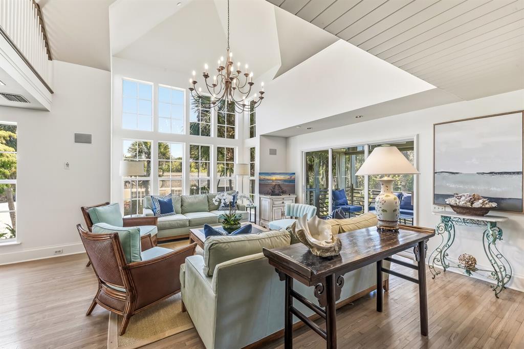 312 Baily Street Boca Grande, FL 33921 - Photo 4 of 41 a living room with furniture large window and wooden floor