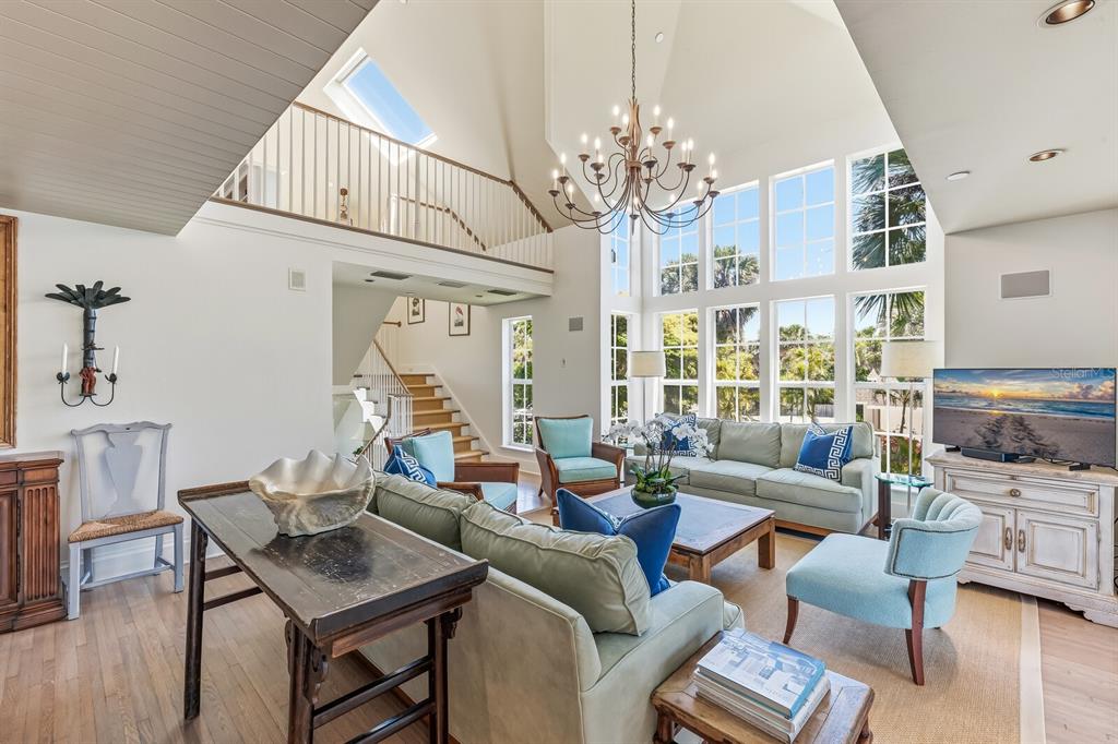 312 Baily Street Boca Grande, FL 33921 - Photo 5 of 41 a living room with fireplace furniture and a chandelier