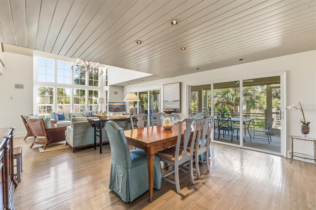 312 Baily Street Boca Grande, FL 33921 - Photo 8 of 41 a dining room with furniture window and wooden floor