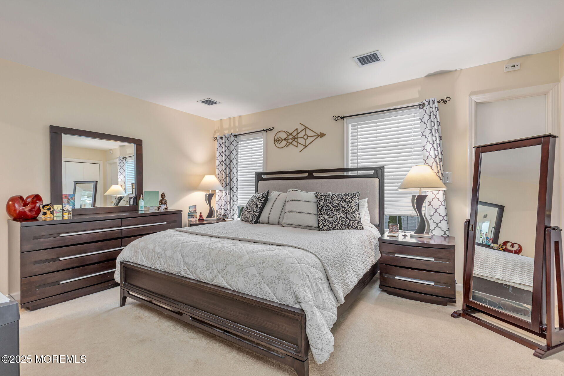 60 County Road, Unit F32 Cliffwood, NJ 07721 - Photo 13 of 31 a bedroom with a bed and a mirror