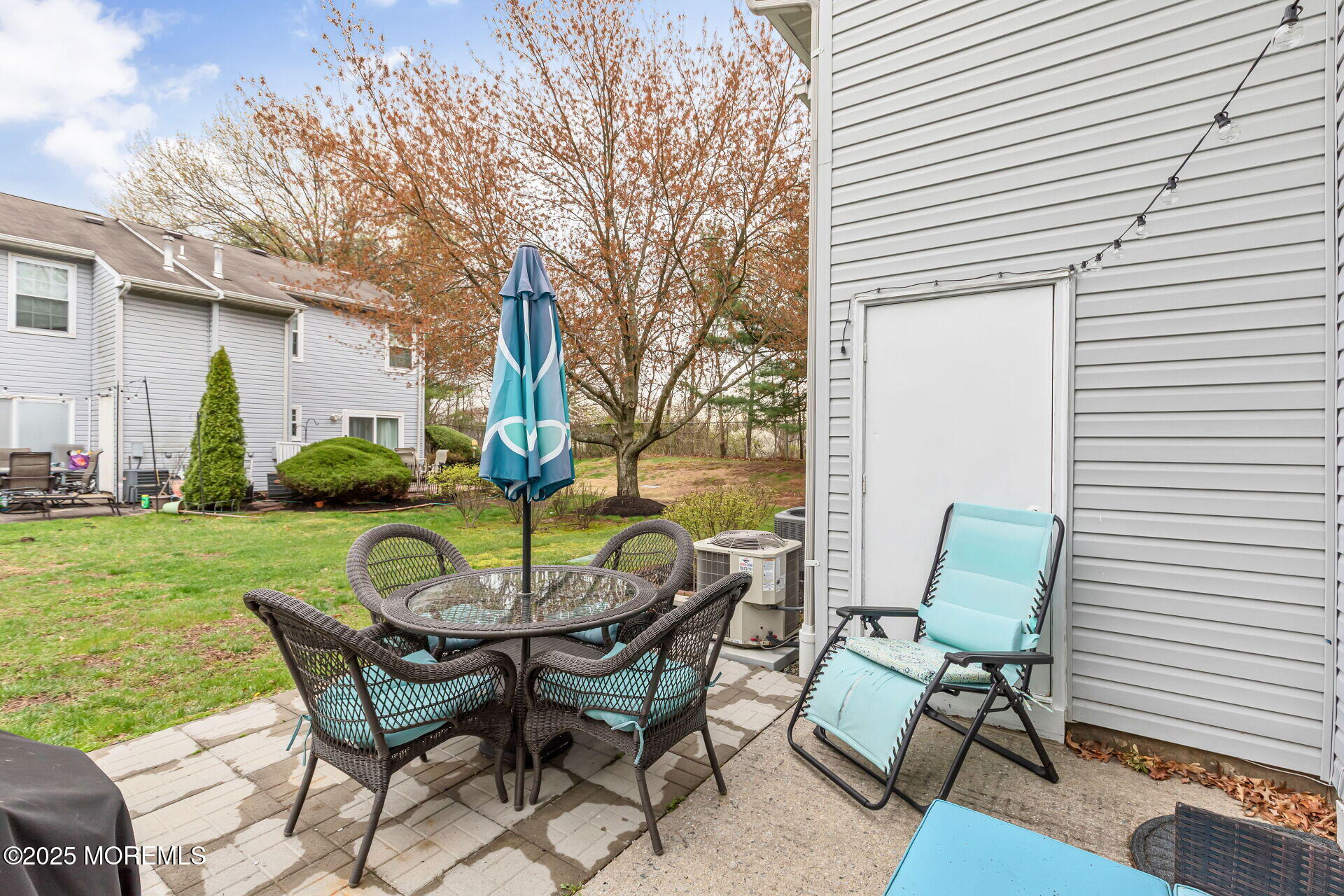 60 County Road, Unit F32 Cliffwood, NJ 07721 - Photo 24 of 31 a view of a patio with table and chairs and potted plants