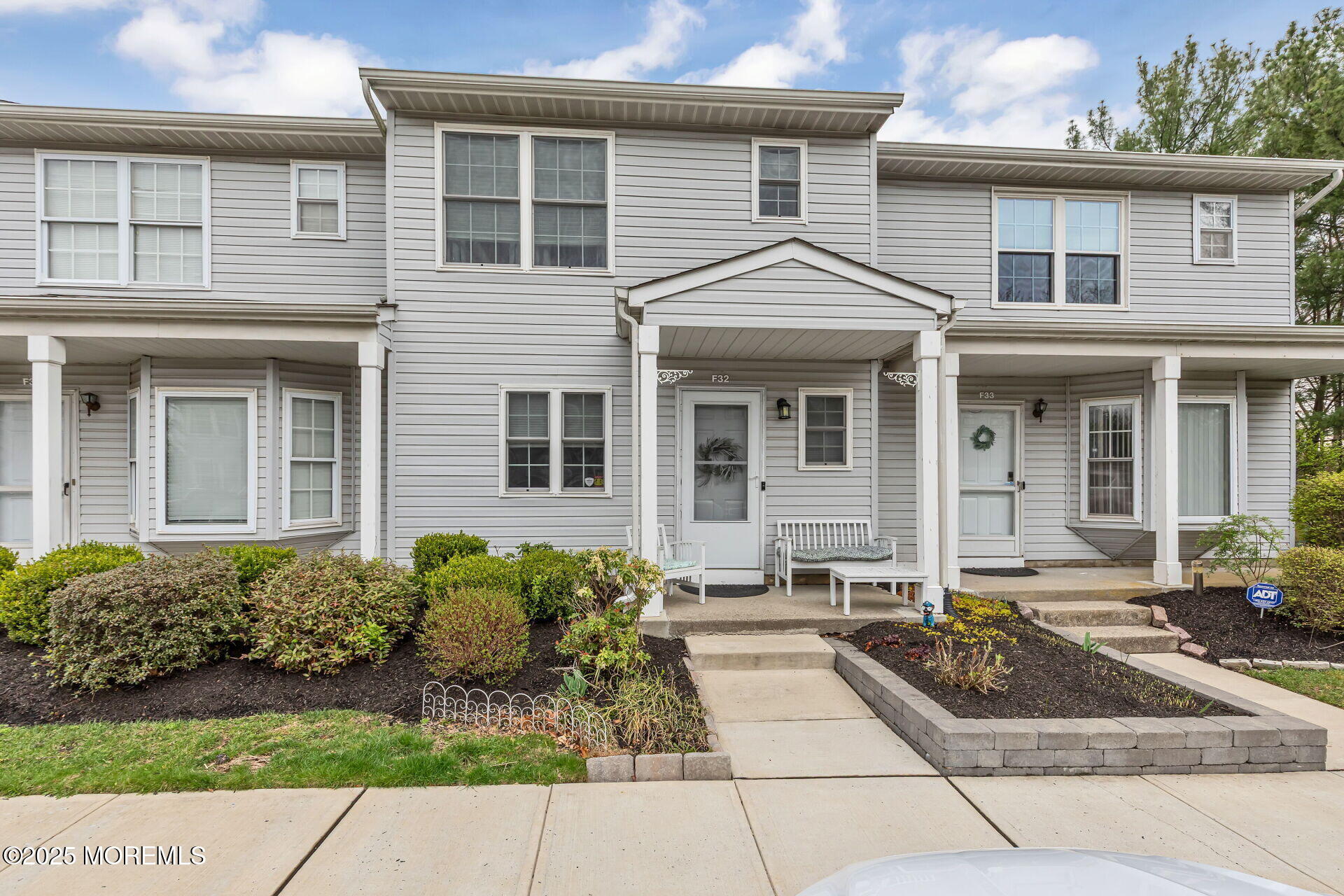 60 County Road, Unit F32 Cliffwood, NJ 07721 - Photo 29 of 31 a front view of a house with garden