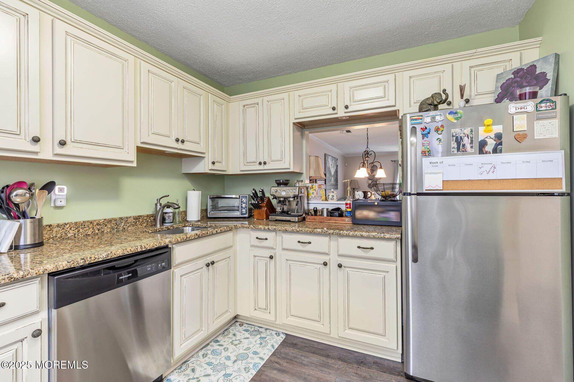 60 County Road, Unit F32 Cliffwood, NJ 07721 - Photo 4 of 31 a kitchen with stainless steel appliances granite countertop a refrigerator sink and white cabinets