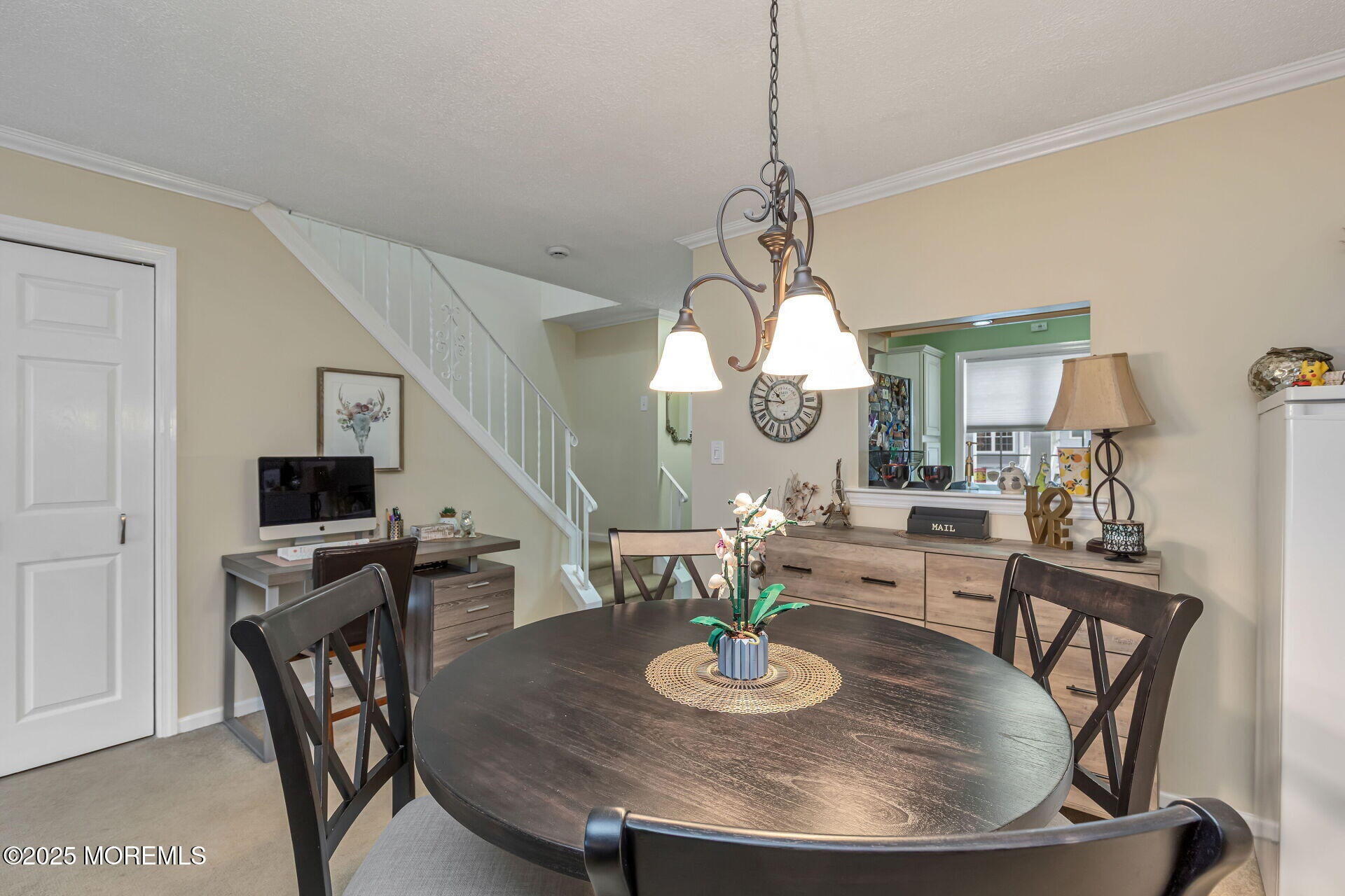 60 County Road, Unit F32 Cliffwood, NJ 07721 - Photo 8 of 31 a view of a dining room with furniture a chandelier and wooden floor