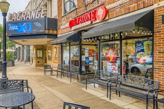 a front view of a house with garden and patio