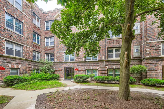 a front view of a building with garden