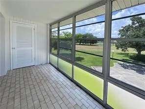 a view of a room with wooden floor and deck
