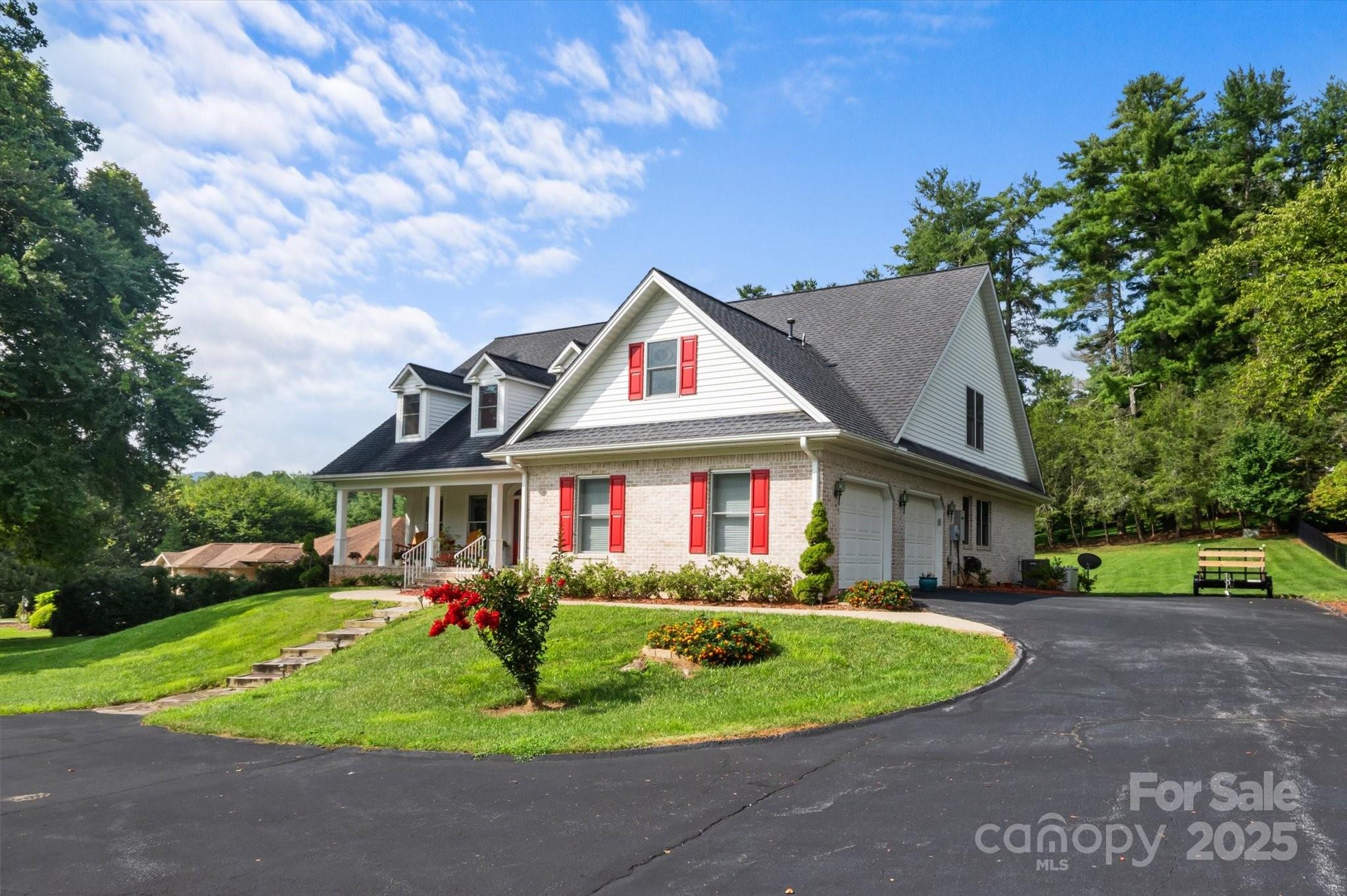 227 Sugar Hollow Road Hendersonville, NC 28739 - Photo 1 of 1 a front view of house with yard and green space