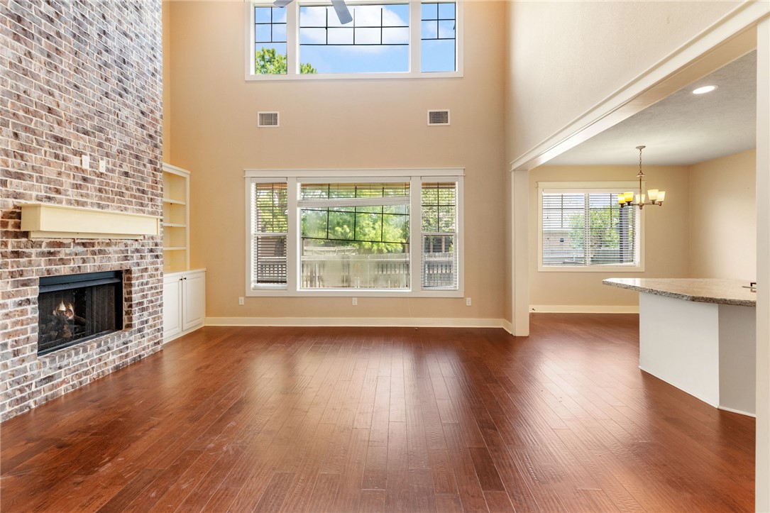 2136 Rockcliffe Loop College Station, TX 77845 - Photo 25 of 48 a view of an empty room with wooden floor and a window