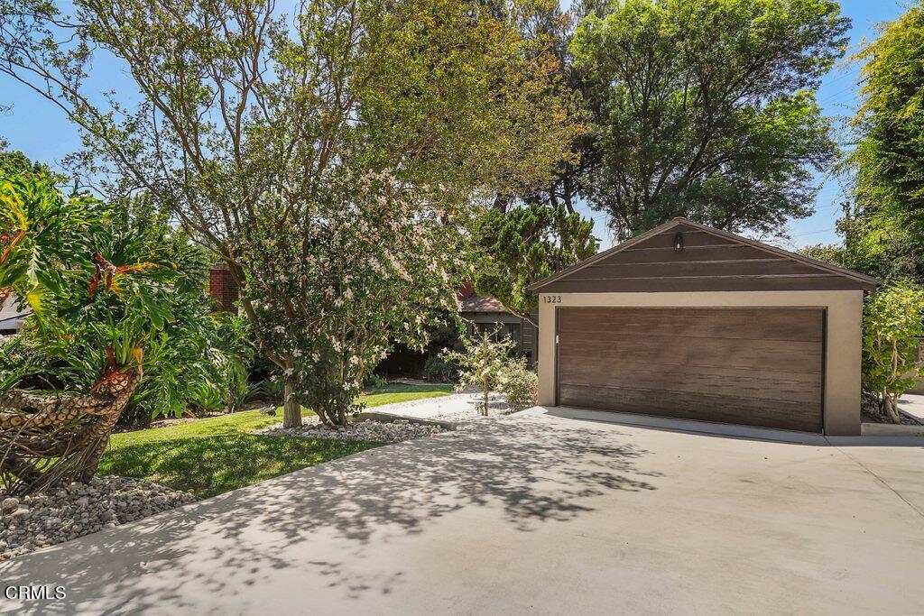 1323 Brampton Road Los Angeles, CA 90041 - Photo 2 of 44 a front view of a house with a yard and garage