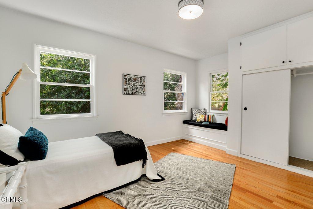 1323 Brampton Road Los Angeles, CA 90041 - Photo 18 of 44 a bedroom with a bed and wooden floor