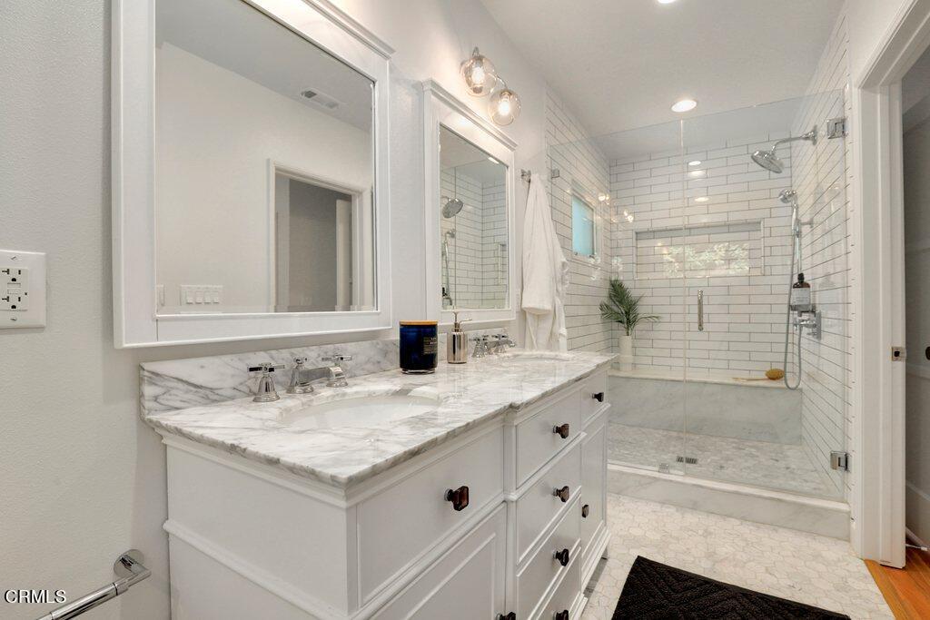 1323 Brampton Road Los Angeles, CA 90041 - Photo 21 of 44 a bathroom with a granite countertop sink a toilet and shower