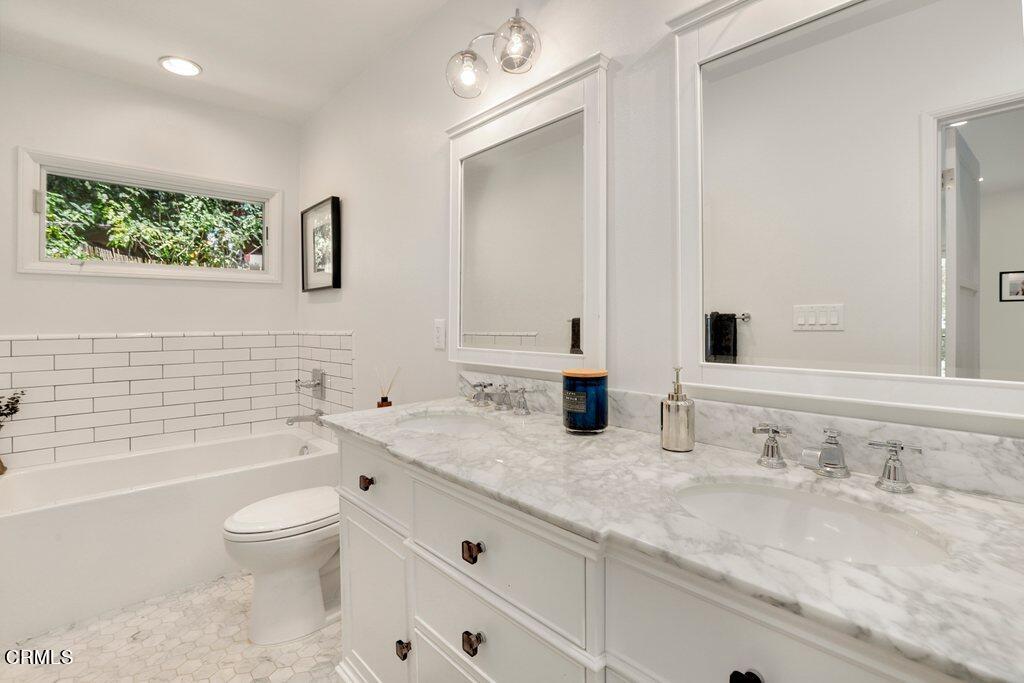 1323 Brampton Road Los Angeles, CA 90041 - Photo 22 of 44 a bathroom with a granite countertop sink a toilet and a bathtub