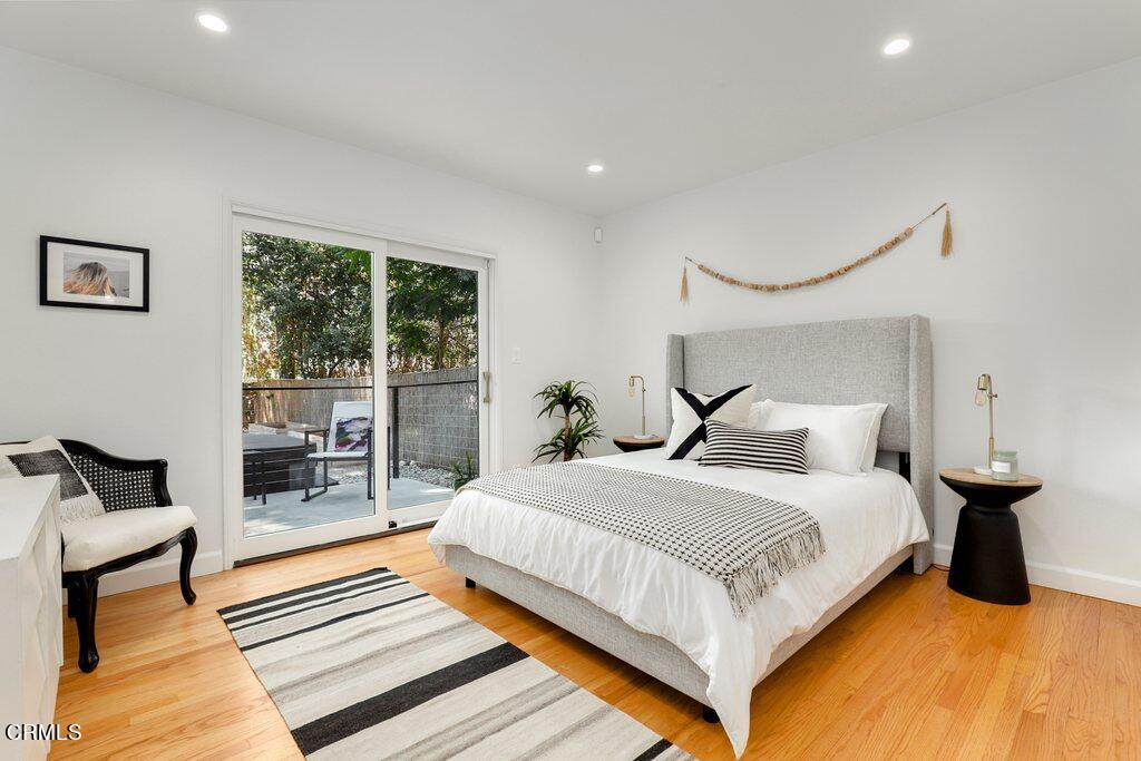 1323 Brampton Road Los Angeles, CA 90041 - Photo 23 of 44 a bedroom with a bed and wooden floor