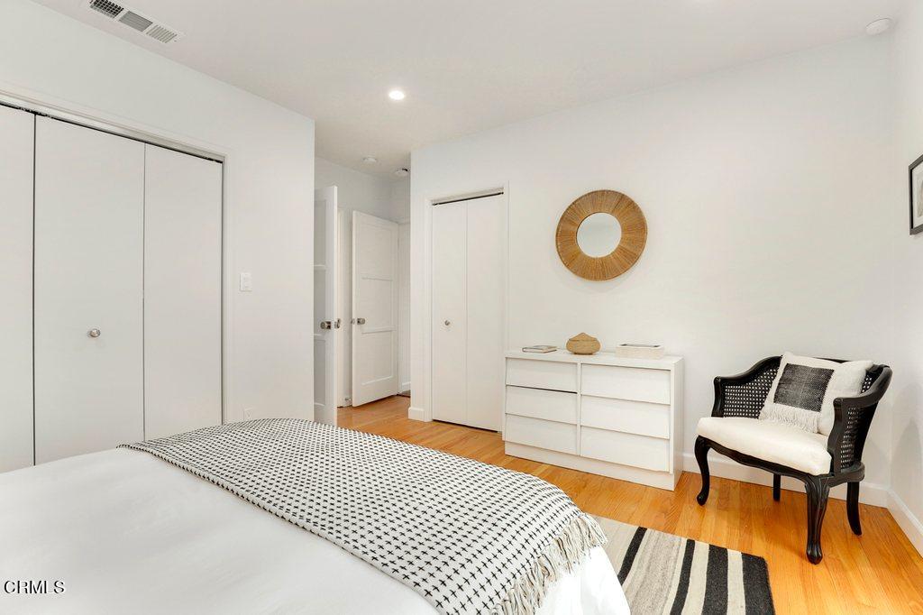 1323 Brampton Road Los Angeles, CA 90041 - Photo 24 of 44 a bedroom with a bed and a lamp on dresser