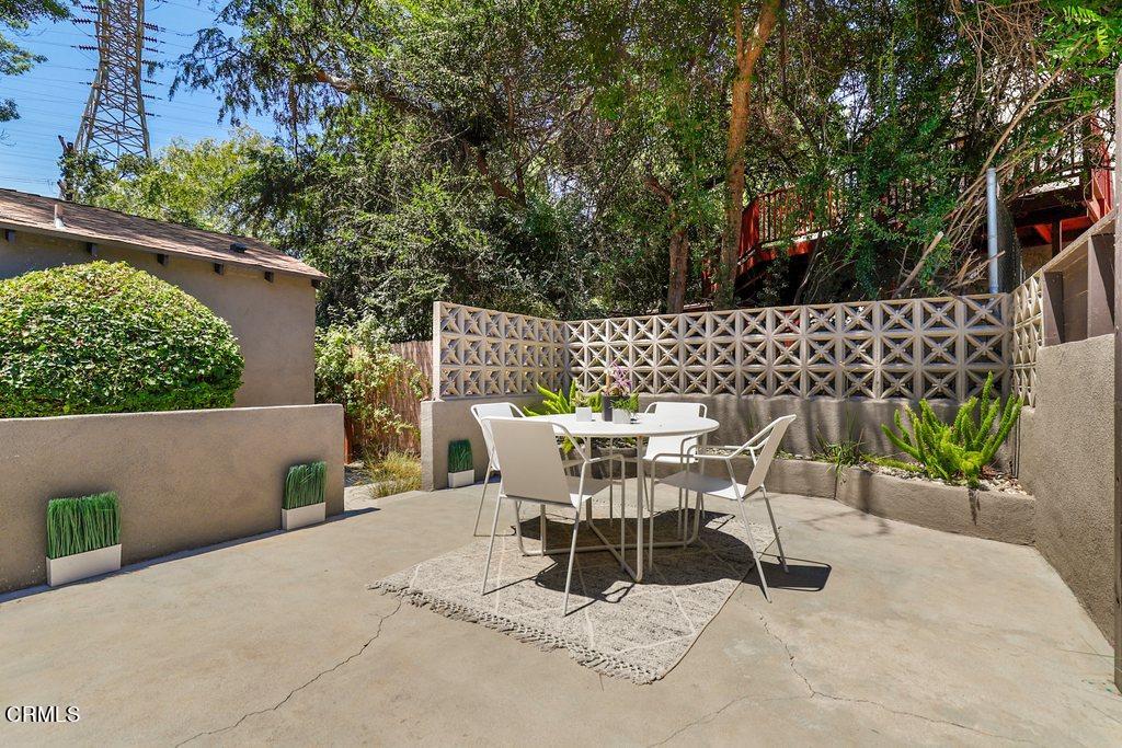 1323 Brampton Road Los Angeles, CA 90041 - Photo 29 of 44 a view of a chairs and table in the back yard of the house