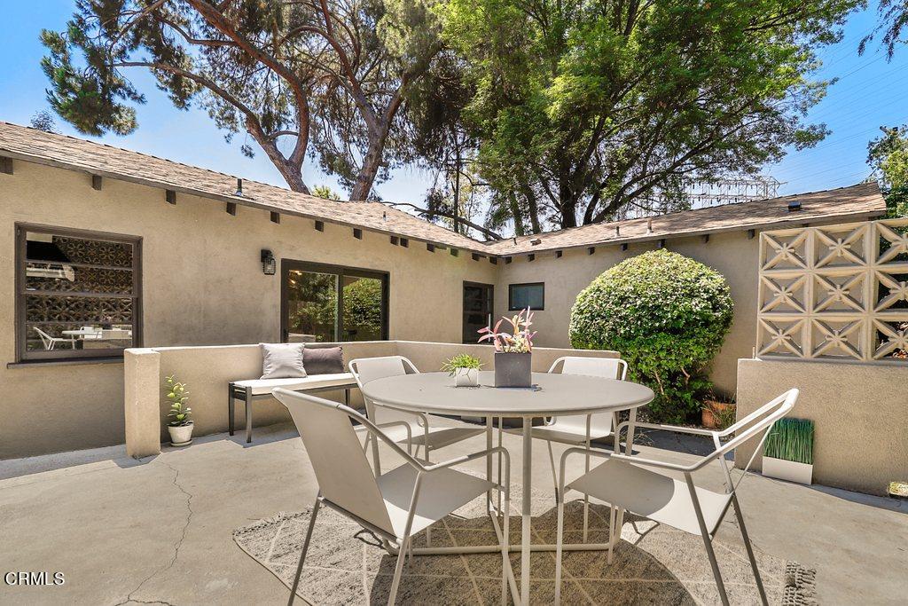 1323 Brampton Road Los Angeles, CA 90041 - Photo 30 of 44 a view of a patio with table and chairs and potted plants
