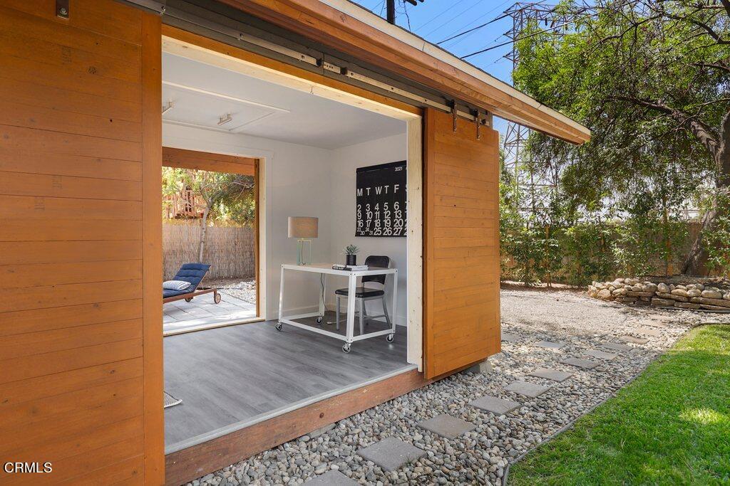 1323 Brampton Road Los Angeles, CA 90041 - Photo 35 of 44 a view of a porch with wooden floor and a bench
