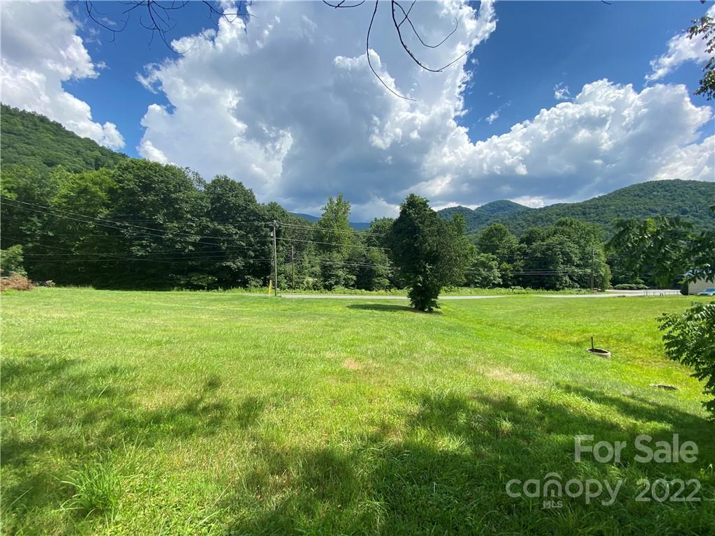4765 Cane Creek Road Bakersville, NC 28705 - Photo 3 of 34 a view of a green field with sitting space