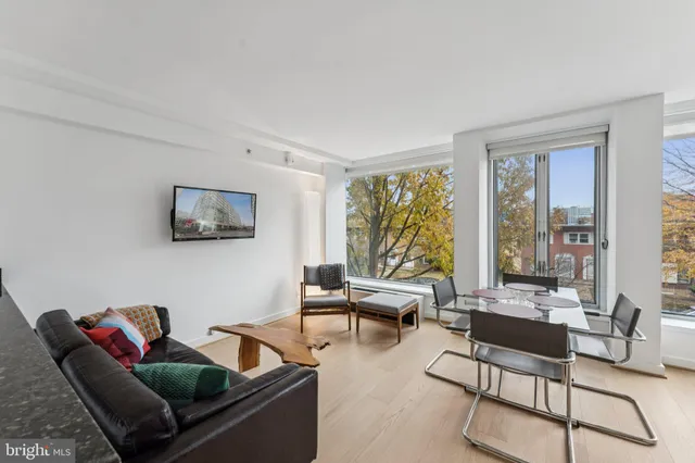 a bedroom with a large bed and a balcony