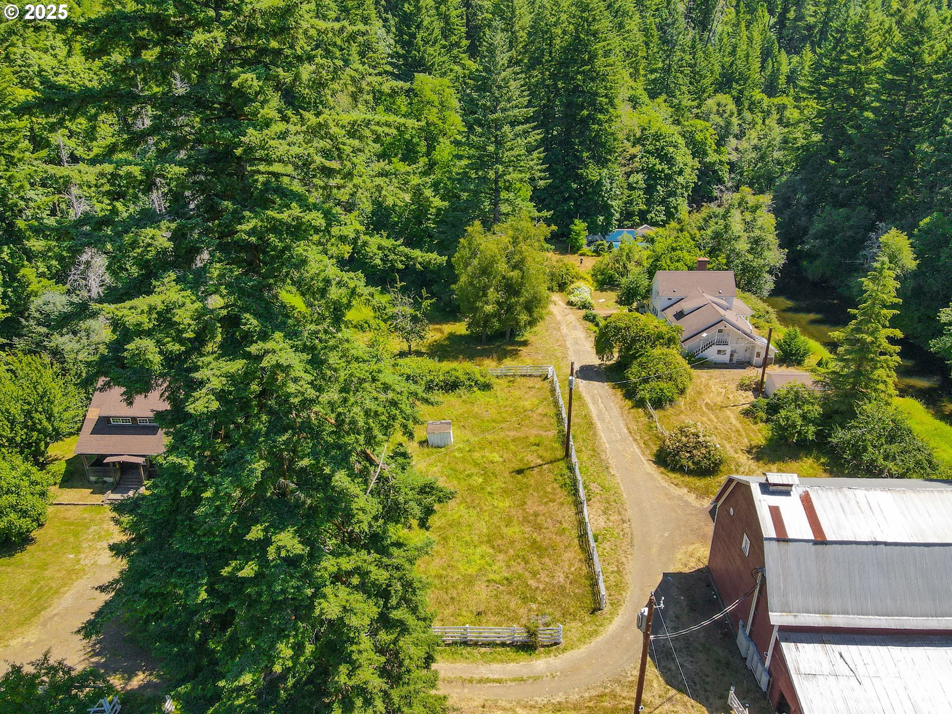 90450 Deadwood Creek Road Deadwood, OR 97430 - Photo 11 of 47 an aerial view of residential house with swimming pool and lawn chairs
