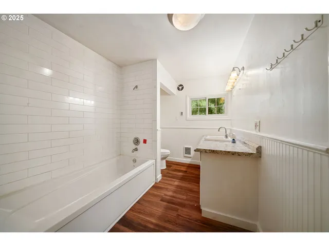 a bathroom with a sink a bathtub and a shower