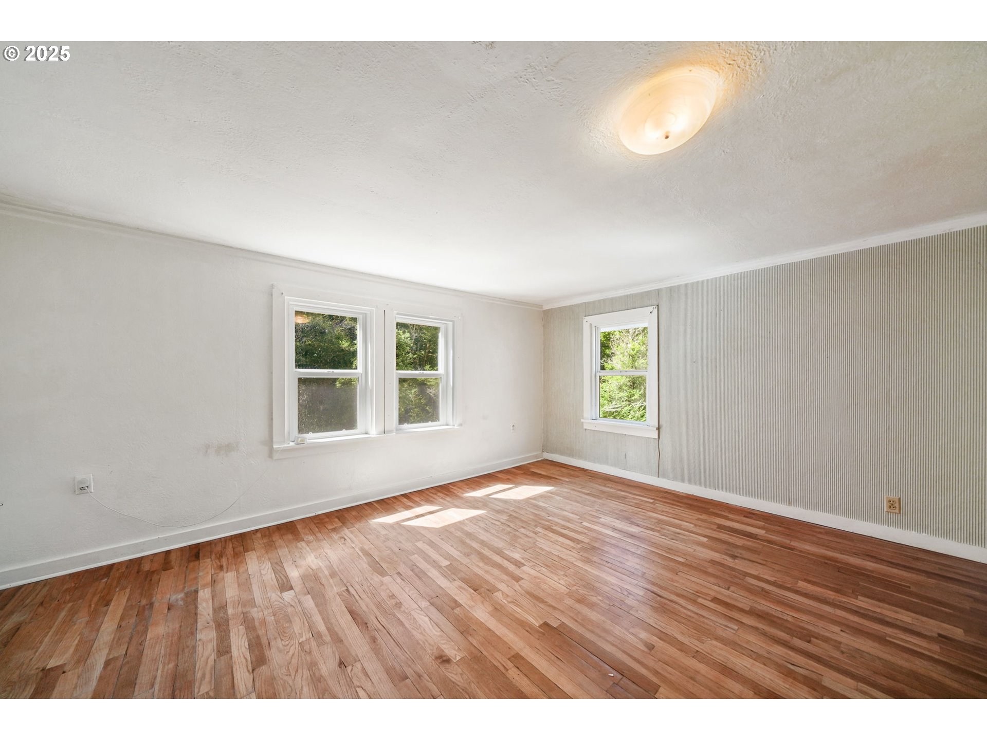 90450 Deadwood Creek Road Deadwood, OR 97430 - Photo 30 of 47 a view of an empty room with a window and wooden floor