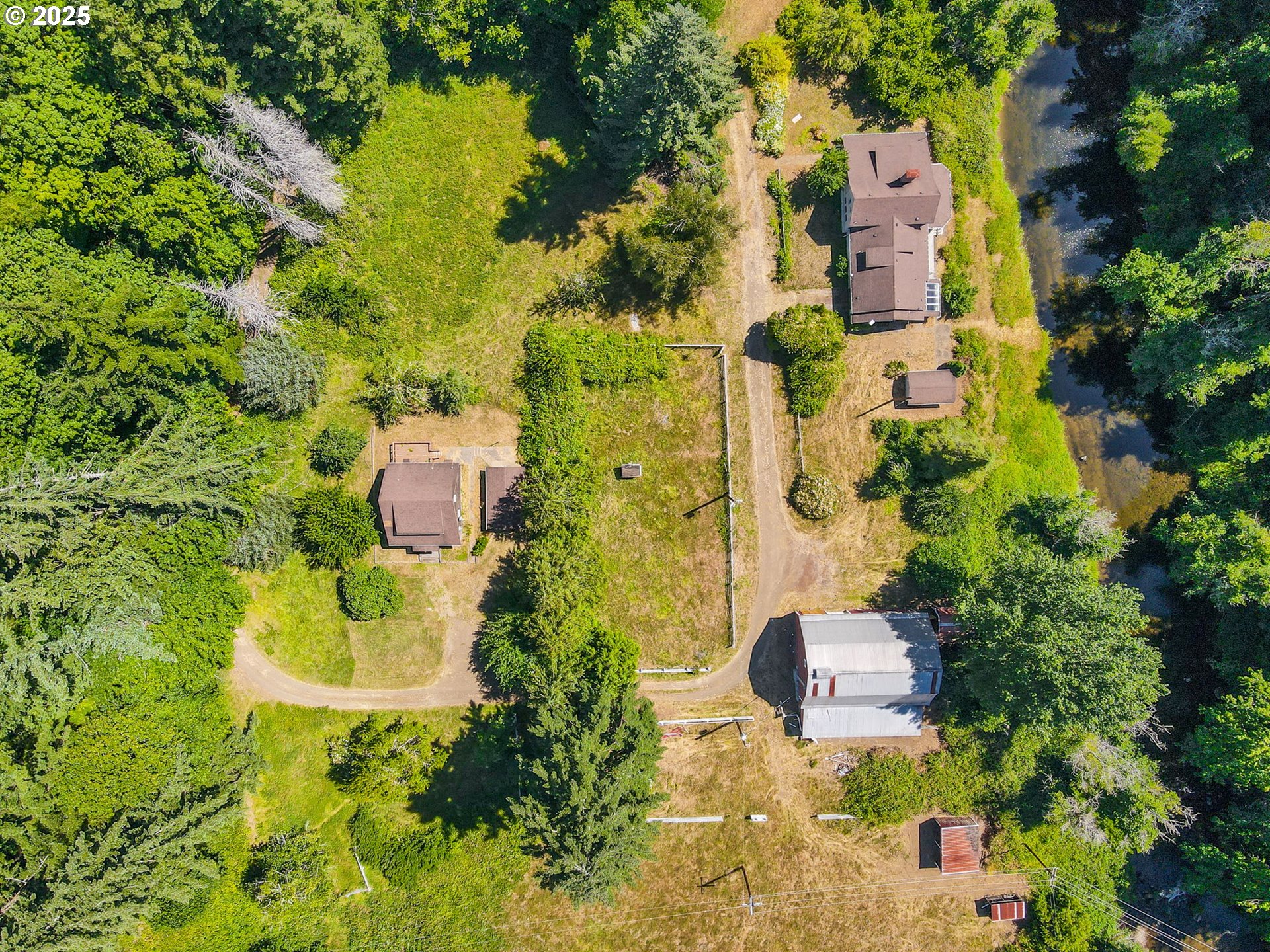 90450 Deadwood Creek Road Deadwood, OR 97430 - Photo 3 of 47 an aerial view of residential house with swimming pool and large trees