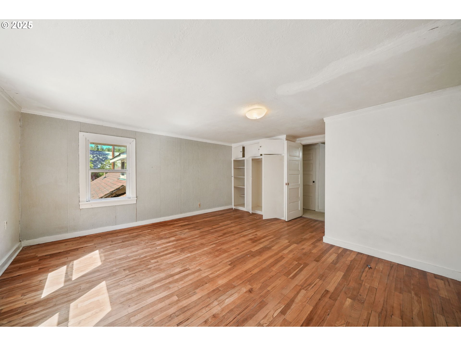 90450 Deadwood Creek Road Deadwood, OR 97430 - Photo 31 of 47 a view of an empty room with wooden floor