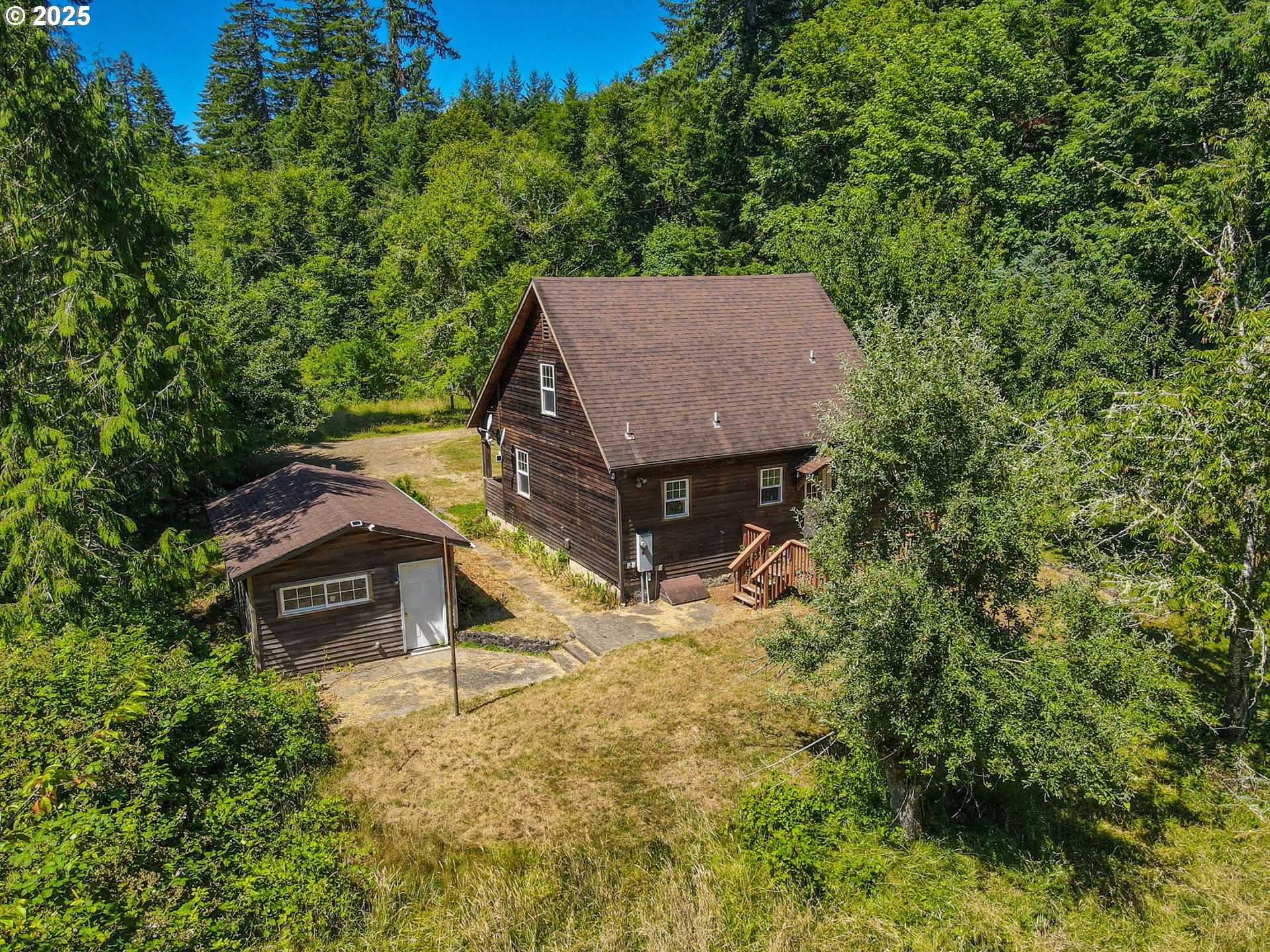 90450 Deadwood Creek Road Deadwood, OR 97430 - Photo 36 of 47 a view of a house with a yard and large tree