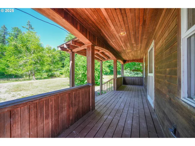 a view of outdoor space with wooden floor