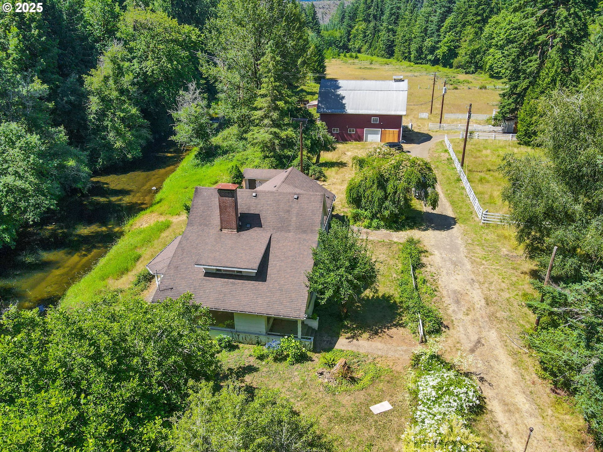 90450 Deadwood Creek Road Deadwood, OR 97430 - Photo 9 of 47 an aerial view of a house with a garden