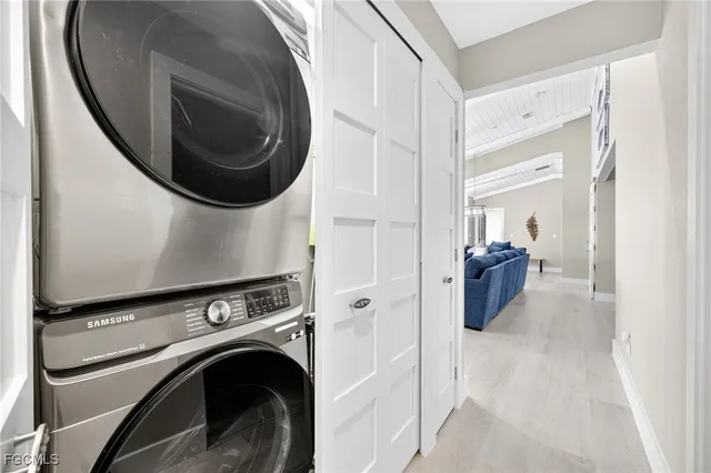 a view of a storage & utility room with a washer dryer