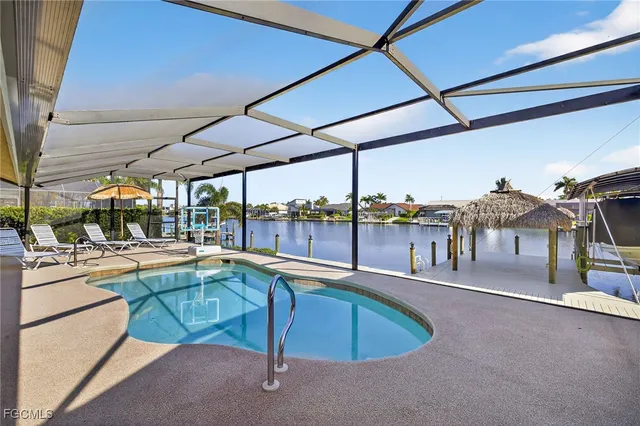 a view of a swimming pool with a patio