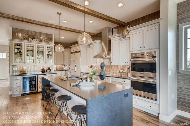 a kitchen with a sink stainless steel appliances and cabinets