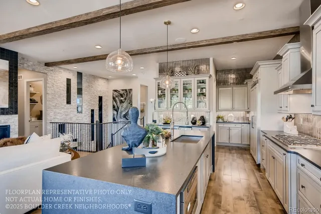 a kitchen with stainless steel appliances granite countertop a lot of counter space
