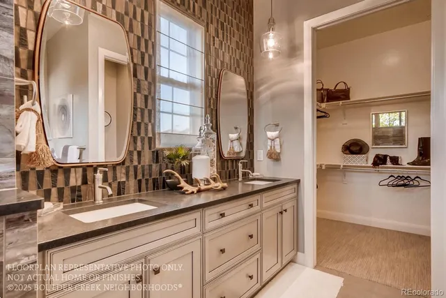 a bathroom with a double vanity sink and a mirror