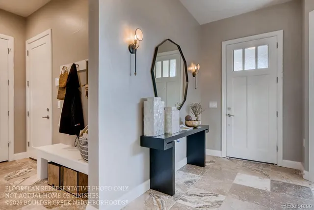 a view of a mirror light fixtures and entryway